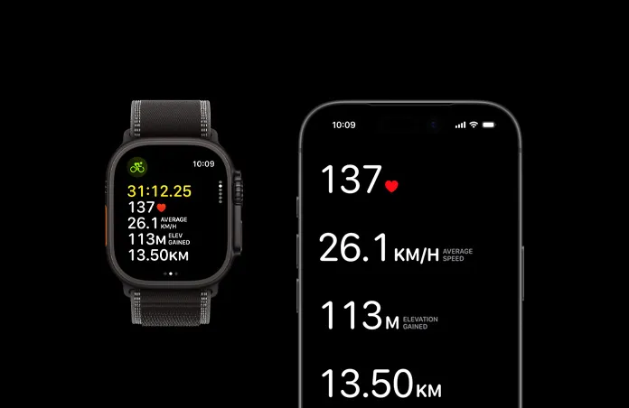 Apple Watch Ultra 3，採用黑色鈦金屬錶殼，配以黑色配木炭色越野手環，旁邊有一部 iPhone，兩部裝置均開啟了進行中的體能訓練指標