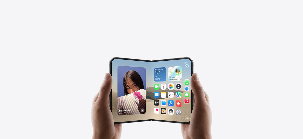 iPhone Duo, held by two hands in landscape orientation, unfolded, interior display features Home Screen