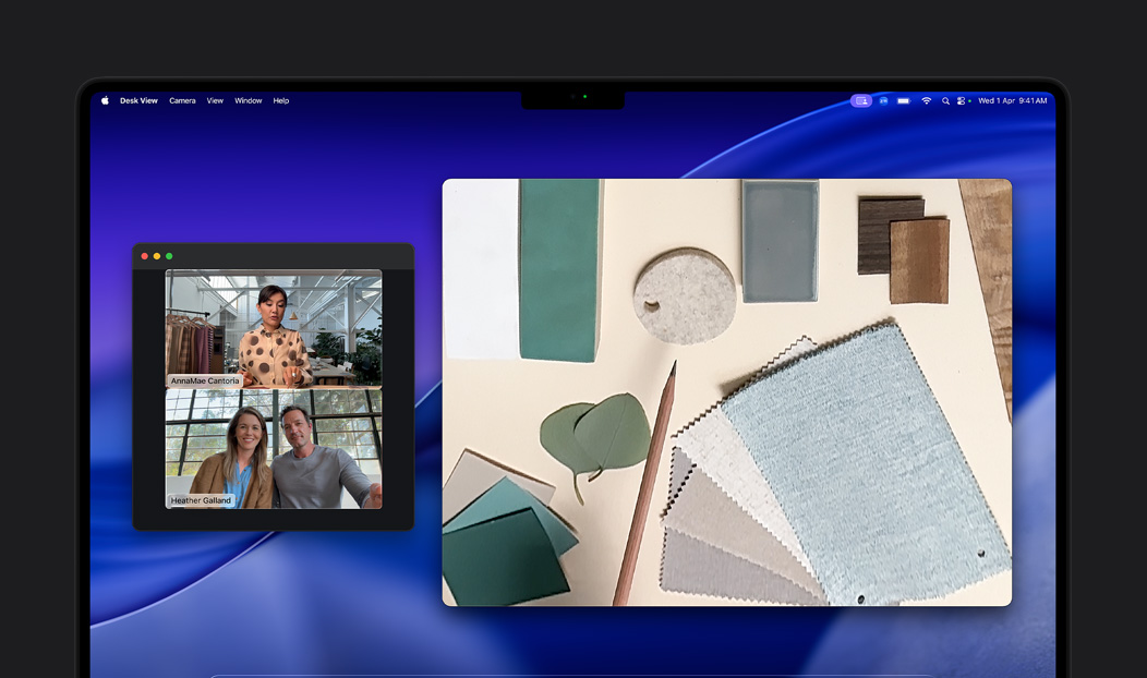 A video call on MacBook Pro of a person using the Desk View feature to show their workspace filled with fabric squares to two people on the call, Desk View lets them show their workspace and their face simultaneously