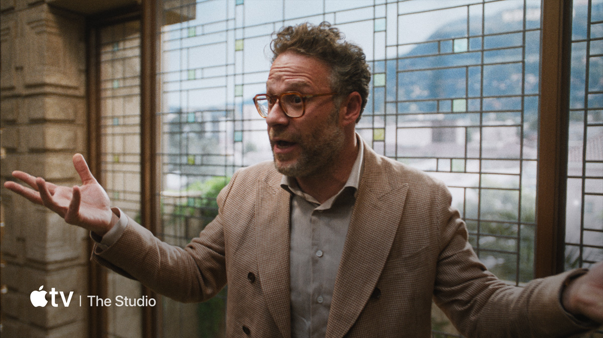 A flatscreen television showing a static image of "The Studio" available on Apple TV