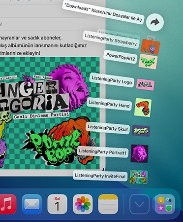 Alt kısımda yer alan Dock’un yakın çekim görüntüsü, bir dizi dosya Dock’tan yukarı doğru yelpaze şeklinde açılıyor.