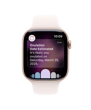 Apple Watch Series 11, bílý sportovní řemínek, zobrazené softwarové položky Ovulace, Historie cyklů