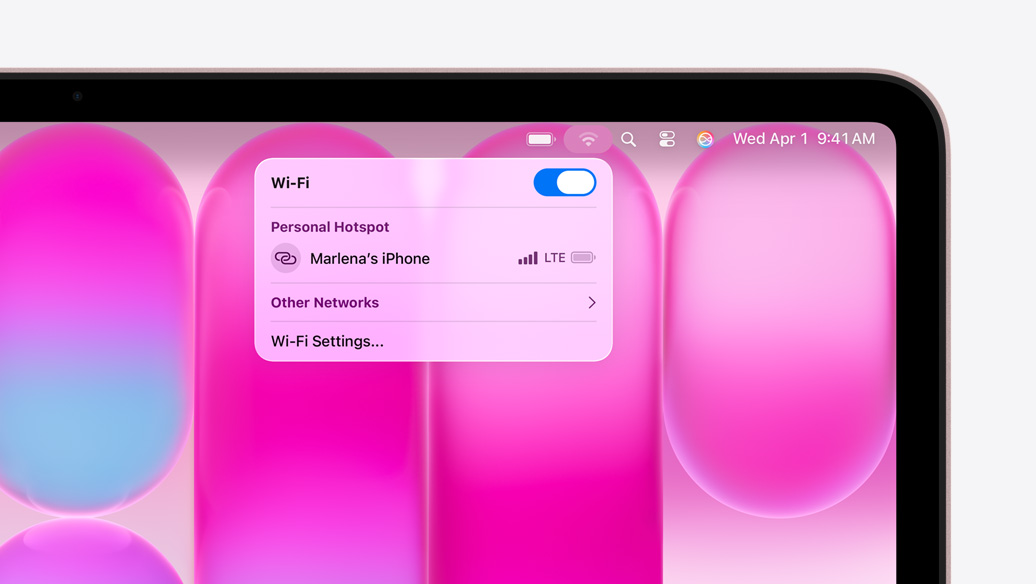 MacBook Neo, blush color, Wi-Fi menu shows Personal Hotspot section with ”Marlena's iPhone” as an option to select